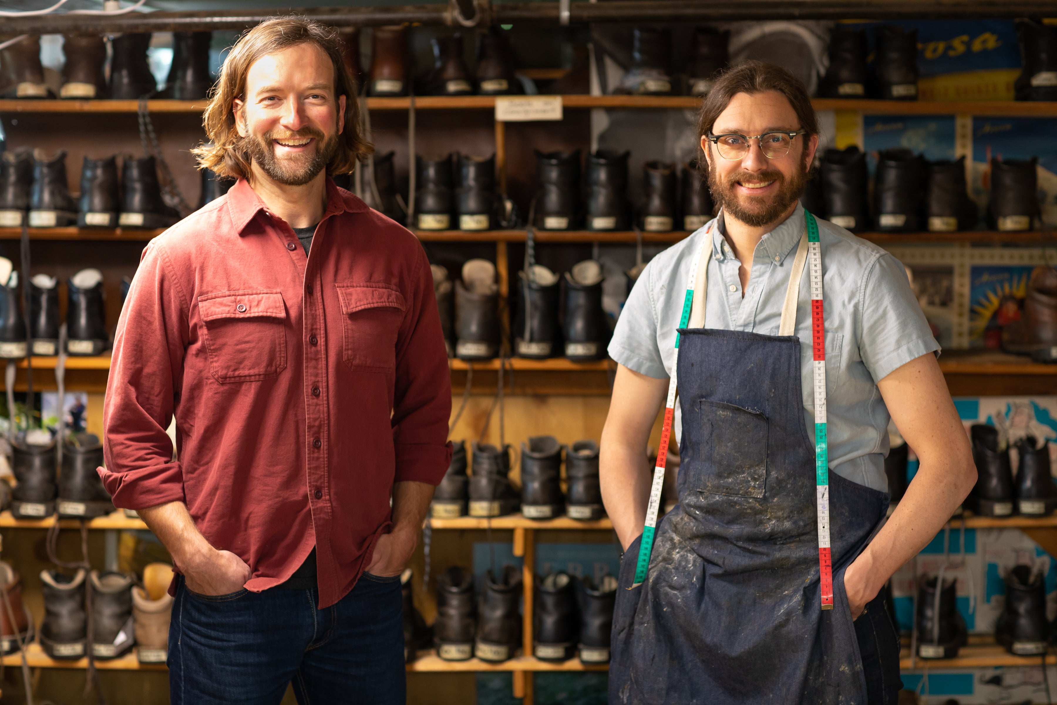 Chris Sawyer and Adam Lane Olsen Standing In Front of Limmer Consignment Hiking Boots at Peter Limmer and Sons